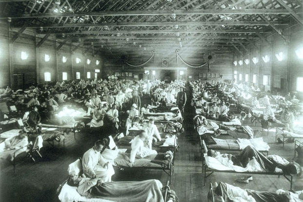 Soldiers suffer from influenza at the hospital in Camp Funston, Kansas, in 1918. 