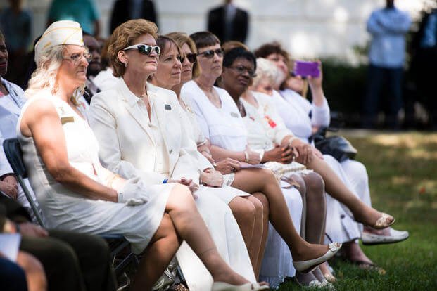 Gold Star Mothers listen during the Commemorative Ceremony for Gold Star Mother's Day in Arlington National Cemetery, Sept. 25, 2016, in Arlington, Va. (U.S. Army/Rachel Larue)