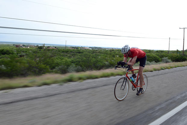 A competitor bikes during an adventure race in Texas.