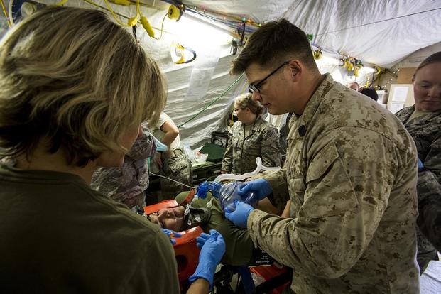 U.S. Navy medical personnel treat a simulated casualty during a mass casualty exercise at an undisclosed location in Southwest Asia, Dec. 23, 2015. (U.S. Marine Corps/Sgt. Rick Hurtado)
