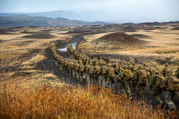 U.S. Marines with the 24th Marine Expeditionary Unit hike to a cold-weather training site inland, Iceland, Oct. 19, 2018, during Exercise Trident Juncture 18. (U.S. Marine Corps/Lance Cpl. Menelik Collins)