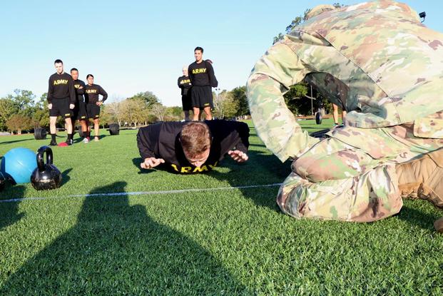 Sgt. 1st Class Brandon Estes, who participated in the ACFT demonstration, demonstrates one alternative for the hand release pushup (lifts hands off the ground in between each pushup). (Military.com/Matthew Cox)