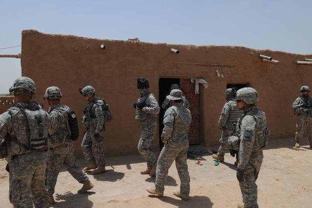 U.S. soldiers assigned to 1st Platoon, 1/37th Armored Delta Company, 1st Brigade, 1st Armored Division conduct a reconnaissance mission in the village of Fukara, Iraq, July 7, 2010. (U.S. Army photo/Charles Smith)