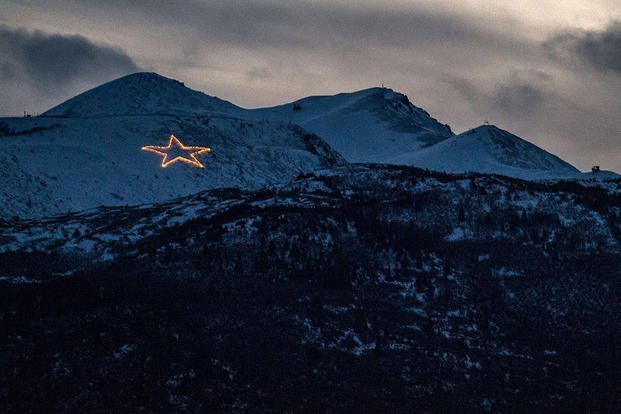 Since 1958, the Christmas star has illuminated the skyline of Anchorage. The star sits atop Mount Gordon Lyon in the Chugach mountain range at Joint Base Elmendorf-Richardson and is lit every year in conjunction with Anchorage’s City of Lights celebration. (U.S. Air Force photo/James Richardson)