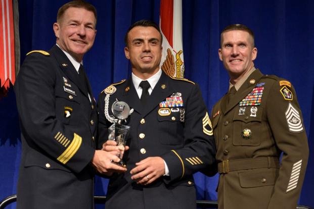 Sergeant Major of the Army Daniel Dailey (far right) wears a version of new Army Green uniform at the 2018 Association of the United States Army’s Annual Meeting and Exposition. (U.S. Army)