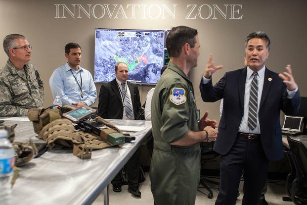 Rep. Mark Takano of California's 41st congressional district, right, talks to 163d Attack Wing Vice Commander Col. Keith Ward, second from right, while touring the wing's new Hap Arnold Center Feb. 23, 2017 at March Air Reserve Base, California. (Air National Guard photo/Crystal Housman)