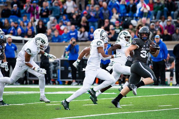 Falcons fullback Cole Fagan rushes through the Colorado State University Rams defense gaining a first down at Falcon Stadium Nov. 22, 2018. (U.S. Air Force Academy photo by Joshua Armstrong)