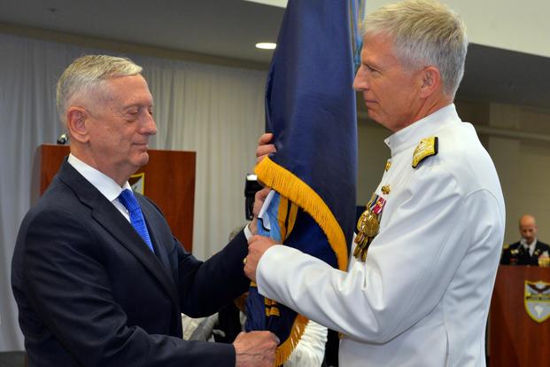 U.S. Secretary of Defense James Mattis, left, passes the U.S. Southern Command guidon to Adm. Craig S. Faller, USN, during the change of command ceremony held at SOUTHCOM's headquarters in Miami, Fla. Monday, November 26, 2018. (DoD Photo/Raymond Sarracino)