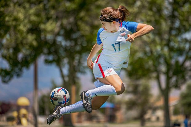 Air Force 2nd Lt. Alicia Bridel practices a rainbow kick at Kirtland Air Force Base, N.M., July 20, 2018. Bridel, an operational research analyst, was a member of the 2012 Messiah College team, that year's Division III women's soccer champions. (U.S. Air Force photo by Staff Sgt. Timothy Koster)