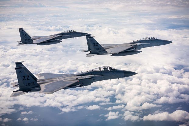 F-15C Eagles fly in formation over the East China Sea Dec. 11, 2018, during a routine training exercise out of Kadena Air Base, Japan. (U.S. Air Force photo/Matthew Seefeldt)