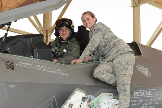 Maj. Rachael Winiecki, 461st Flight Test Squadron F-35 test pilot, and Airman 1st Class Heather Rice, 412th Aircraft Maintenance Squadron crew chief, pose for a photo after Winiecki’s first test mission flight in the fifth-generation fighter Dec. 14, 2018. (U.S. Air Force/Kenji Thuloweit)