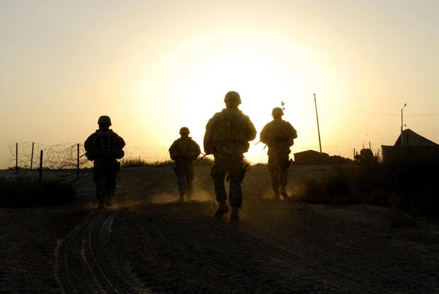 U.S. Army Soldiers of Delta Company, 2nd Battalion, 8th Cavalry, 1st Brigade Combat Team, 1st Cavalry Division, patrol the roads near a tactical checkpoint in Taji, Iraq, Sept. 17, 2007. (Steve Czyz/Army)