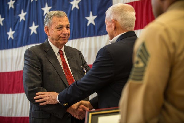 Retired Maj. Gen. John Admire (right) handshakes retired Maj. Edward F. Wright (left) at Portland, Ore., Feb. 1, 2019. Wright was awarded the medal for his actions on Aug. 21, 1967. (Andy O. Martinez/U.S. Marine Corps)