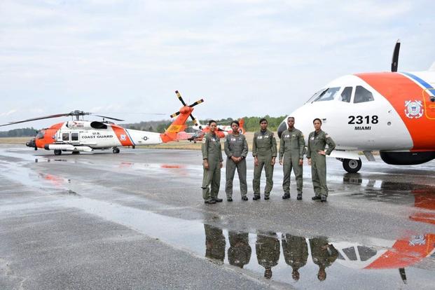 The "Fab-5" standing on historic Tuskegee's Moton Field after attending Lt. Ronaqua Rusell's Air Medal Ceremony, Thursday, February 21, 2019. Pictured from left to right are Coast Guard HC-130 fixed wing pilot Lt. Cmdr. Jeanine Menze, MH-65 helicopter pilot Lt. Cmdr. LaShanda Holmes, HC-144 fixed wing pilot Lt. Angel Hughes, MH-60 helicopter pilot Lt. Chanel Lee, HC-144 fixed wing pilot Lt. Ronaqua Russell. (Ryan P Kelley/U.S. Coast Guard)