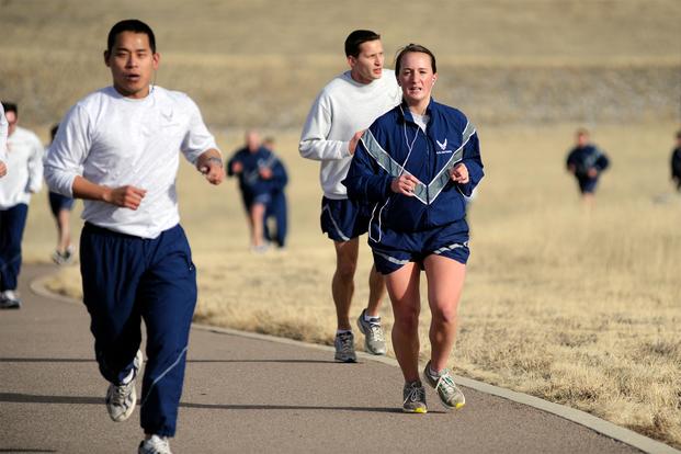 Airman 1st Class Kali Spicer, 50th Force Support Squadron, runs during the 50th Space Wing Warfit Run Feb. 12, 2014, at the Schriever Fitness Center running track. (U.S. Air Force/Dennis Rogers)