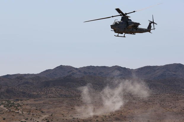 An AH-1Z super cobra helicopter circles around to a target for immediate fire drills at a range northwest of Marine Corps Air Station Yuma, Ariz., Aug. 15., 2013 in support of a team of joint terminal attack controllers with 3RD Air Naval Gunfire Liaison Company Marine Forces Reserve. (U.S. Marine Corps photo/Uriel Avendano)