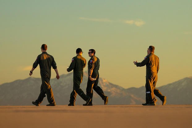 U.S. Air Force demo pilots walk off the flightline during the Heritage Flight Training and Certification Course at Davis-Monthan Air Force Base, Ariz., Feb. 28, 2019. (U.S. Air Force photo/Jensen Stidham)