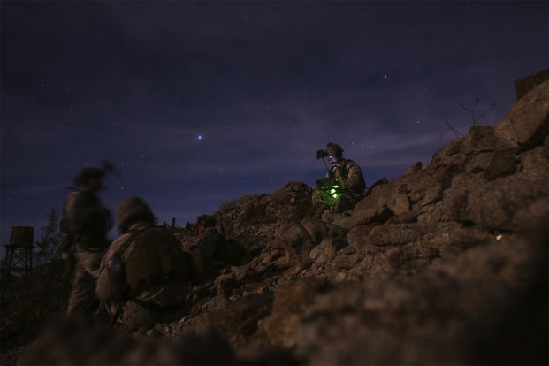 U.S. Marines with 2nd Marine Raider Battalion, Marine Raider Regiment set up communication during a night raid exercise at landing zone Dodo, Ariz., April 21, 2016. (U.S. Marine Corps/Lance Cpl. Zachary M. Ford, MAWTS-1 COMCAM)