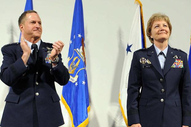 Gen. David L. Goldfein, 21st Chief of Staff of the Air Force, applauds the accomplishments of Lt. Gen. Maryanne Miller during her promotion ceremony at the Museum of Aviation on July 15, 2016. Miller became the first female Citizen Airman to achieve the rank of lieutenant general and the first female commander of Air Force Reserve Command. Tommie Horton/Air Force