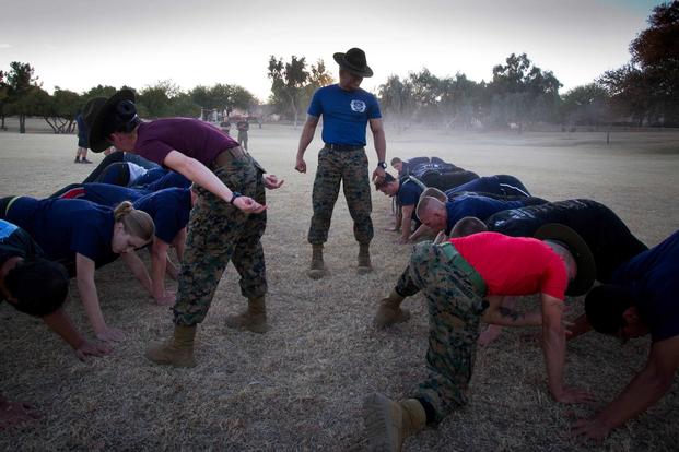 Drill instructors from Marine Corps Recruit Depots San Diego and Parris Island, S.C., physically train Marine Corps Recruiting Substation Chandler enlistees at the Arrowhead Meadows Park in Chandler, Ariz., on Jan. 23, 2013. (U.S. Marine Corps photo by Cpl. Tyler J. Bolken)