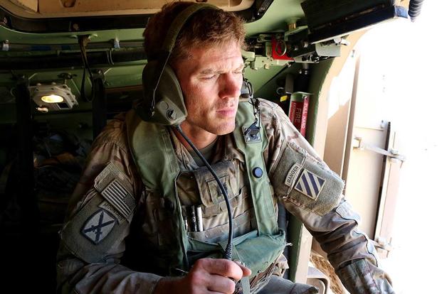 Capt. Eric Cannon, commander of Charlie Company, 2nd Battalion, 69th Armor Regiment, talks on the radio in his Bradley Fighting Vehicle during 2nd Brigade Combat Team’s rotation at the National Training Center at Fort Irwin, California. Matthew Cox/Military.com