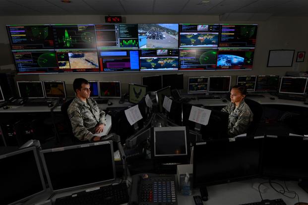 Airmen work in the Global Strategic Warning and Space Surveillance System Center at Cheyenne Mountain Air Force Station, Colo., Sept. 2, 2014. The 721st CS ensures constant dataflow of information to the North American Aerospace Defense Command (NORAD). (U.S. Air Force/Airman 1st Class Krystal Ardrey)