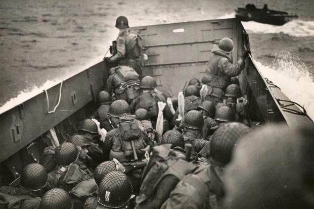 US soldiers from the 1st Infantry Division aproach Omaha Beach in a landing craft. (Photo: The National WWII Museum)
