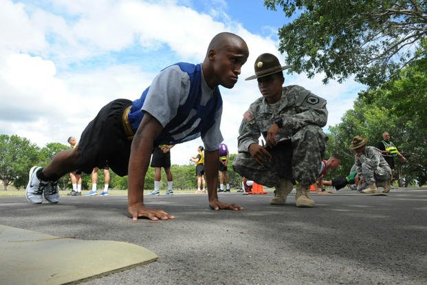 Soldier pumps out push-ups during a physical fitness test.