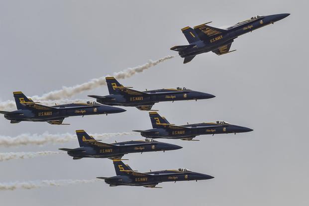 The U.S. Navy Flight Demonstration Squadron, the Blue Angels, pilots perform the pitch-up break maneuver during a demonstration at the Star Spangled Salute Air and Space Show at Tinker Air Force Base in Oklahoma City. (U.S. Navy/Mass Communication Specialist 2nd Class Timothy Schumaker)