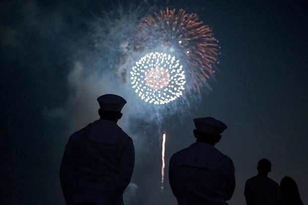 Sailors enjoy fireworks during the 42nd annual Yokosuka Friendship Day celebration onboard U.S. Fleet Activities (FLEACT) Yokosuka. (U.S. Navy/Garrett Zopfi)