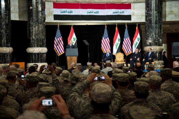 FILE PHOTO -- This file photo shows the ceremony from Dec. 1, 2011, Iraq's Day of Commitment. The ceremony hosted by the Iraqi government at Al Faw Palace, in Baghdad, Iraq would be the last of its kind as U.S. forces continue to draw out of Iraq. U.S. Vice President Joe Biden, took the opportunity to thank U.S. and Iraqi service members for all of their sacrifices that led to the end of an almost decade long war. (Caleb Barrieau/U.S. Forces Iraq)
