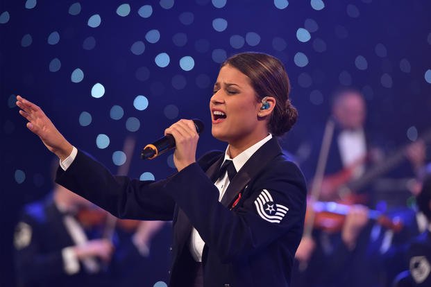 Air Force Tech. Sgt. Nalani Quintello, lead singer of the Air Force Band’s rock band Max Impact, sings at an event, Nov. 3, 2015. (U.S. Air Force/ Bob Kamholz)