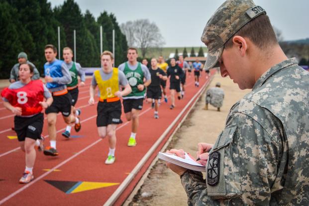 Clemson University Reserve Officers' Training Corps cadet Jared Stoltz, a senior from Fayetteville, North Carolina, majoring in criminal justice, tracks his fellow cadets as they run two miles during an Army Physical Fitness Test Jan. 15, 2015. U.S. Army soldiers are required to pass the test at least once every six months. It consists of two minutes of push-ups, two minutes of sit-ups and the timed two-mile run. (Ken Scar/U.S. Army)