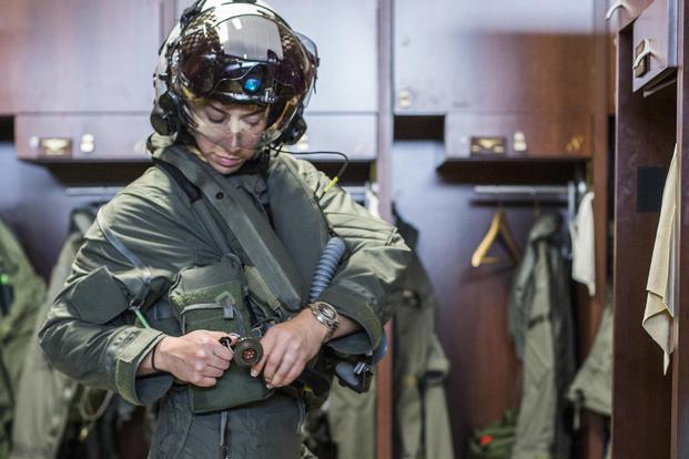 Capt. Anneliese Satz connects an air hose to her flight suit aboard Marine Corps Air Station Beaufort, South Carolina, on March 11. Satz graduated the F-35B Lighting II Pilot Training Program in June and will be assigned to Marine Fighter Attack Squadron 121 in Iwakuni, Japan. (U.S. Marine Corps photo by Sgt. Ashley Phillips)