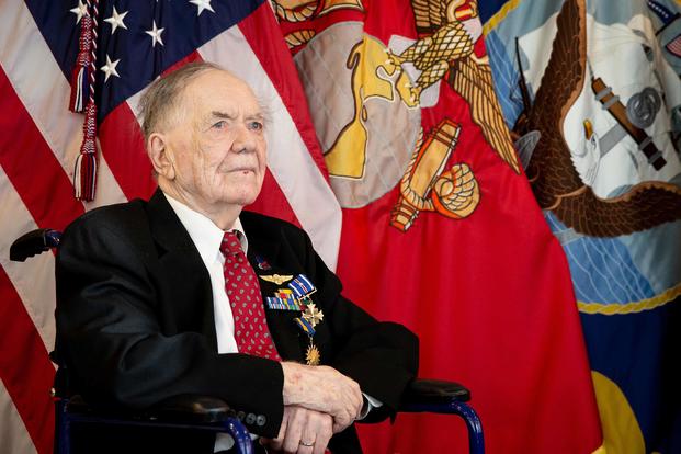 Retired Aviation Machinist's Mate 1st Class Bernard B. Bartusiak, 95, listens to his family members speak after being awarded with two Distinguished Flying Cross medals and the Air Medal (Strike/Flight), 2nd-8th awards, by Navy Secretary Richard V. Spencer on Sept. 10, 2019, for meritorious service during World War II involving aerial flight from April 20, 1943, to August 26, 1944. (U.S. Navy photo by Mass Communication Specialist 1st Class Paul L. Archer)