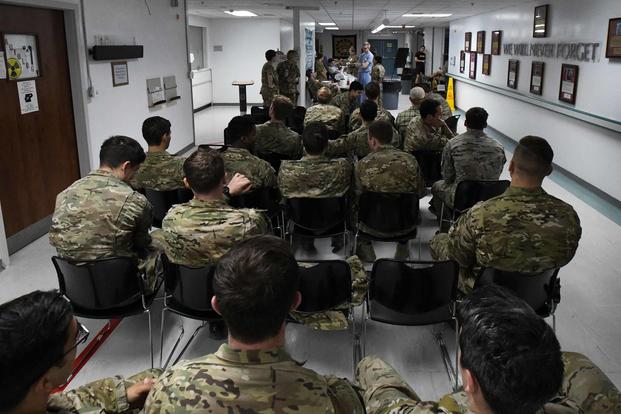 Service members wait in line to donate blood at Craig Joint Theater Hospital at Bagram Airfield, Afghanistan, on Aug. 18, 2019, as part of a "walking blood bank" for a fellow service member being transferred to Brooke Army Medical Center in San Antonio. A request for volunteers with a specific blood type was filled within minutes, providing fresh whole blood to sustain the patient during the lengthy flight home. (U.S. Air Force photo by Airman 1st Class Ryan Mancuso)