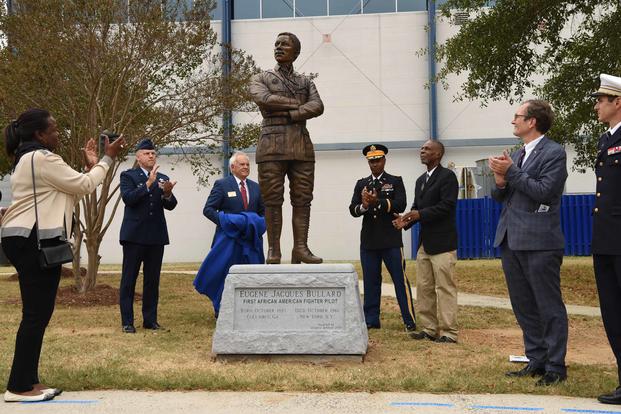 A statue in honor of 2nd Lt. Eugene Jacques Bullard, the first African-American fighter pilot, is unveiled during a ceremony at the Museum of Aviation in Warner Robins, Georgia, on Oct. 9, 2019. The statue was donated to the United States Air Force by the Georgia World War I Centennial Commission. (U.S. air Force photo by Tommie Horton)