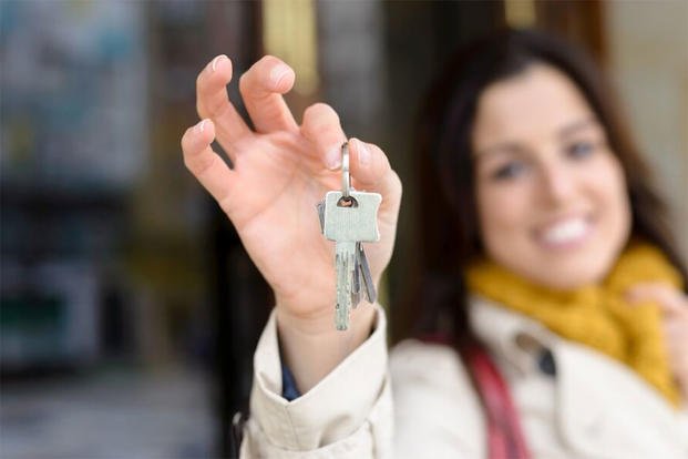 Woman holding house keys