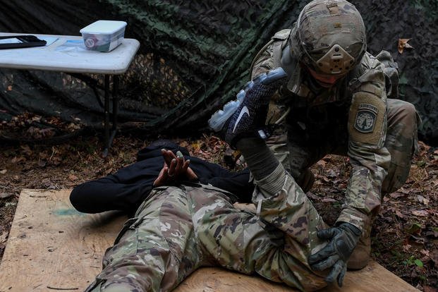U.S. Army Spc. Keenan Baker, a military policeman with the 108th Military Police at Fort Bragg, North Carolina, searches a suspect after apprehension during the Expert Soldier Badge course at Joint Base Langley-Eustis, Virginia, Nov. 18, 2019. (U.S. Air Force photo/Derek Seifert)