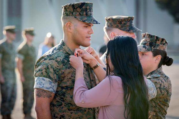 U.S. Marine Corps Cpl. Hector J. Marchi Ramos, a radio operator with the 13th Marine Expeditionary Unit, I Marine Expeditionary Force, is promoted to sergeant by his wife during a promotion ceremony at Marine Corps Base Camp Pendleton, Calif. September 4, 2019. (U.S. Marine Corps/Capt. Joshua P. Hays)