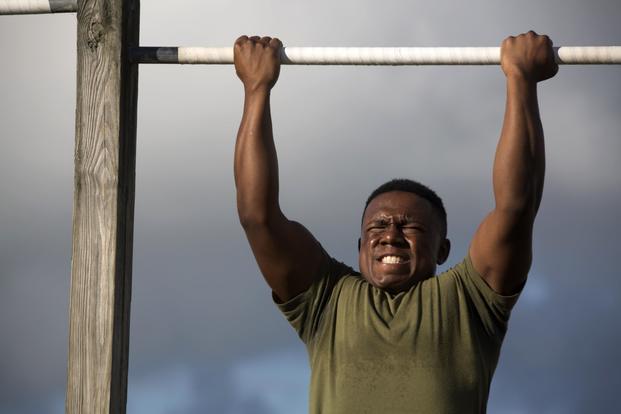 Cherry Point Marine participates in pull-up event. 