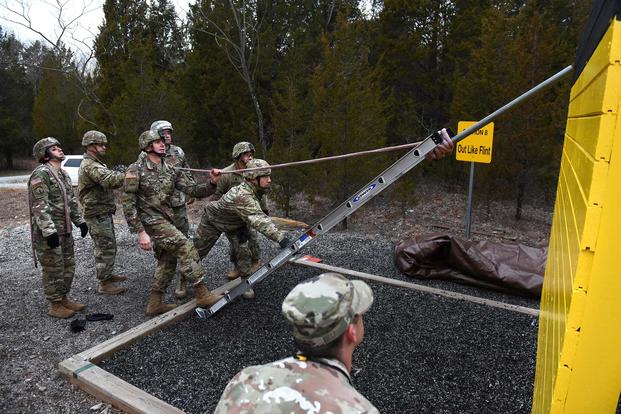Battalion Commander Assessment Program participants negotiate an obstacle Jan. 23, 2020, at Fort Knox, Kentucky. (U.S. Army/Eric Pilgrim)