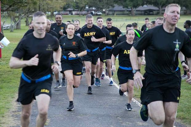 Senior officers begin the two mile run event during a Army Combat Fitness Test.