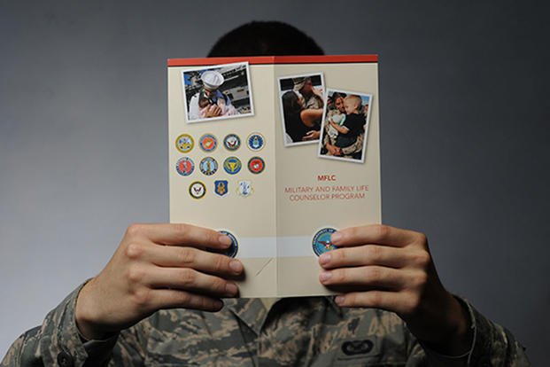 person holding mflc brochure