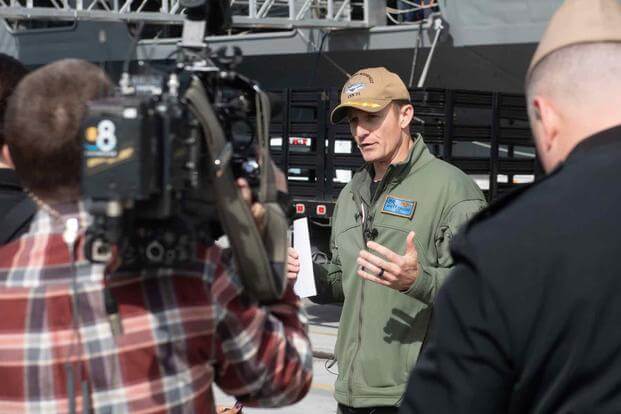 Capt. Brett Crozier, commanding officer of the USS Theodore Roosevelt, addresses news media. 