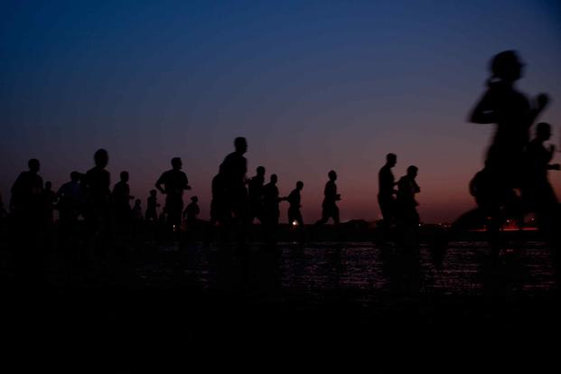 Service members and civilians participate in the Marine Corps Marathon Forward at Camp Leatherneck, Helmand province.