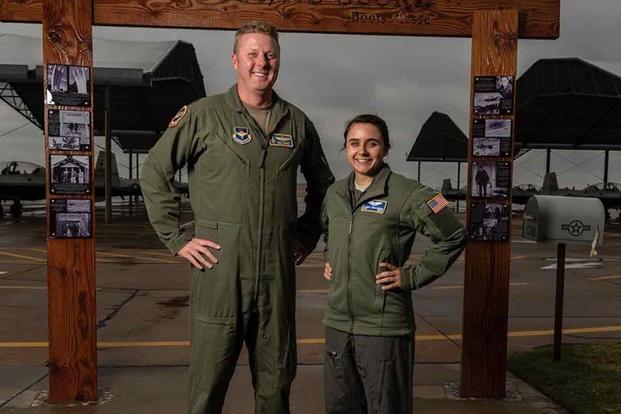 U.S. Air Force Maj. Nick Harris and Capt. Jessica Wallander stand side-by-side.