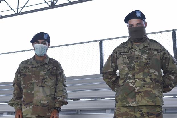 Pvt. Carlos Mora and Spc. Juan Guajardo recently graduated Basic Combat Training.