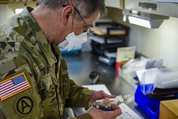 Army Lt. Col. John Falzone, a pharmacist aboard the Military Sealift Command hospital ship Comfort