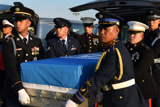 United Nations Command Honor Guard remove a dignified transfer case